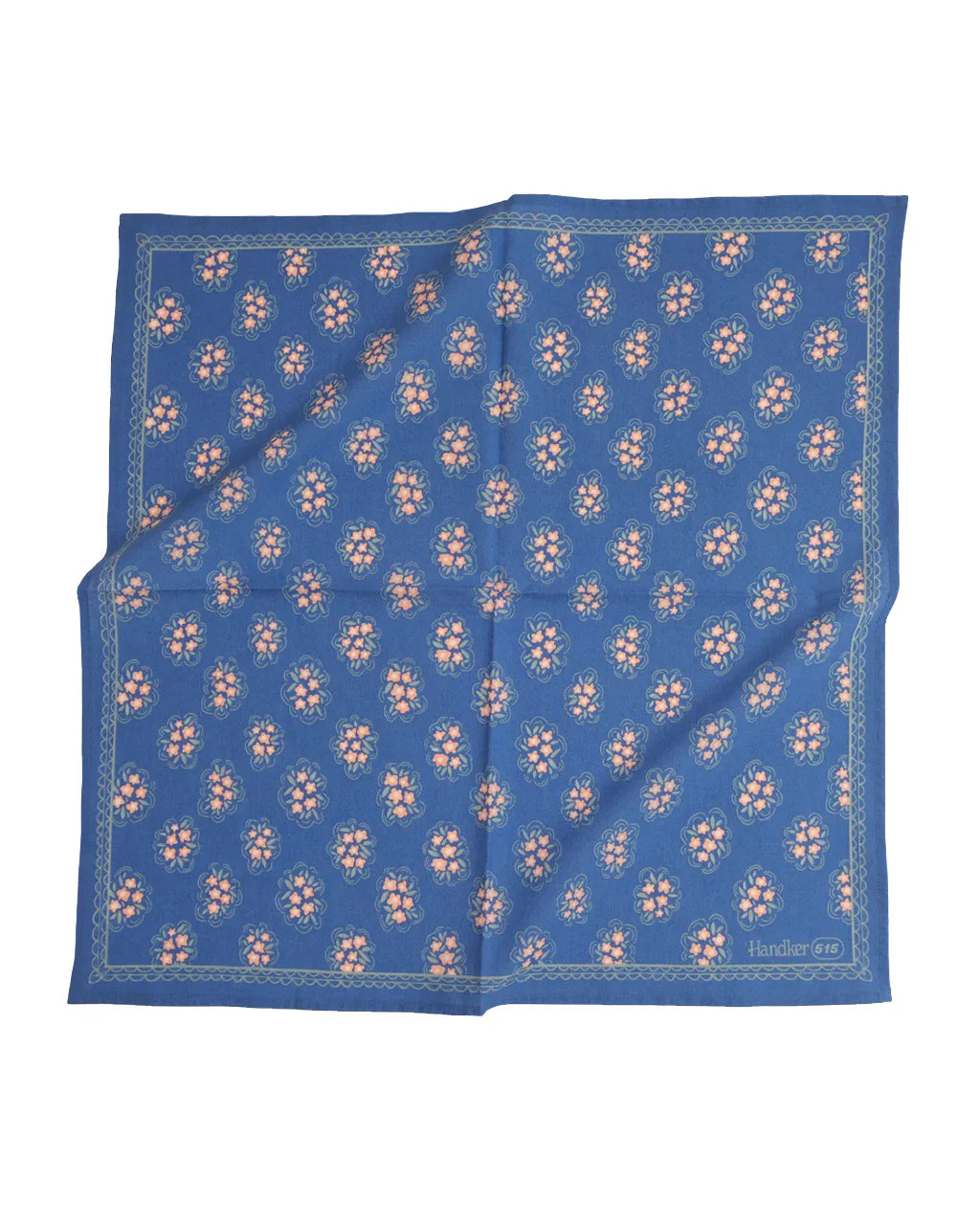 Pink floral pattern on blue bandana laying flat on a white background