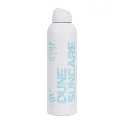 Dune Suncare spray bottle on a white background